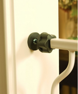 pressure mounted baby gate fixed onto door frame