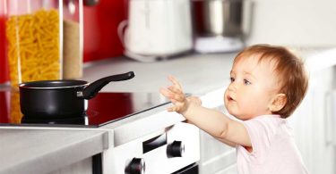 Baby reaching for pan: Childproofing your kitchen