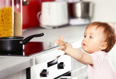 Baby reaching for pan: Childproofing your kitchen