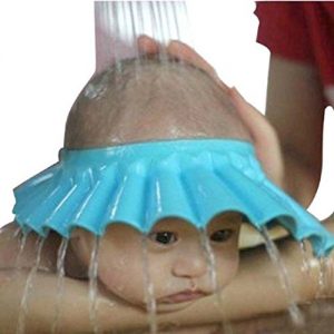 Baby Proof the Bathroom: Baby wearing bath visor with water pouring on his head