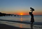 Traveling with baby: A mother and baby at sunset